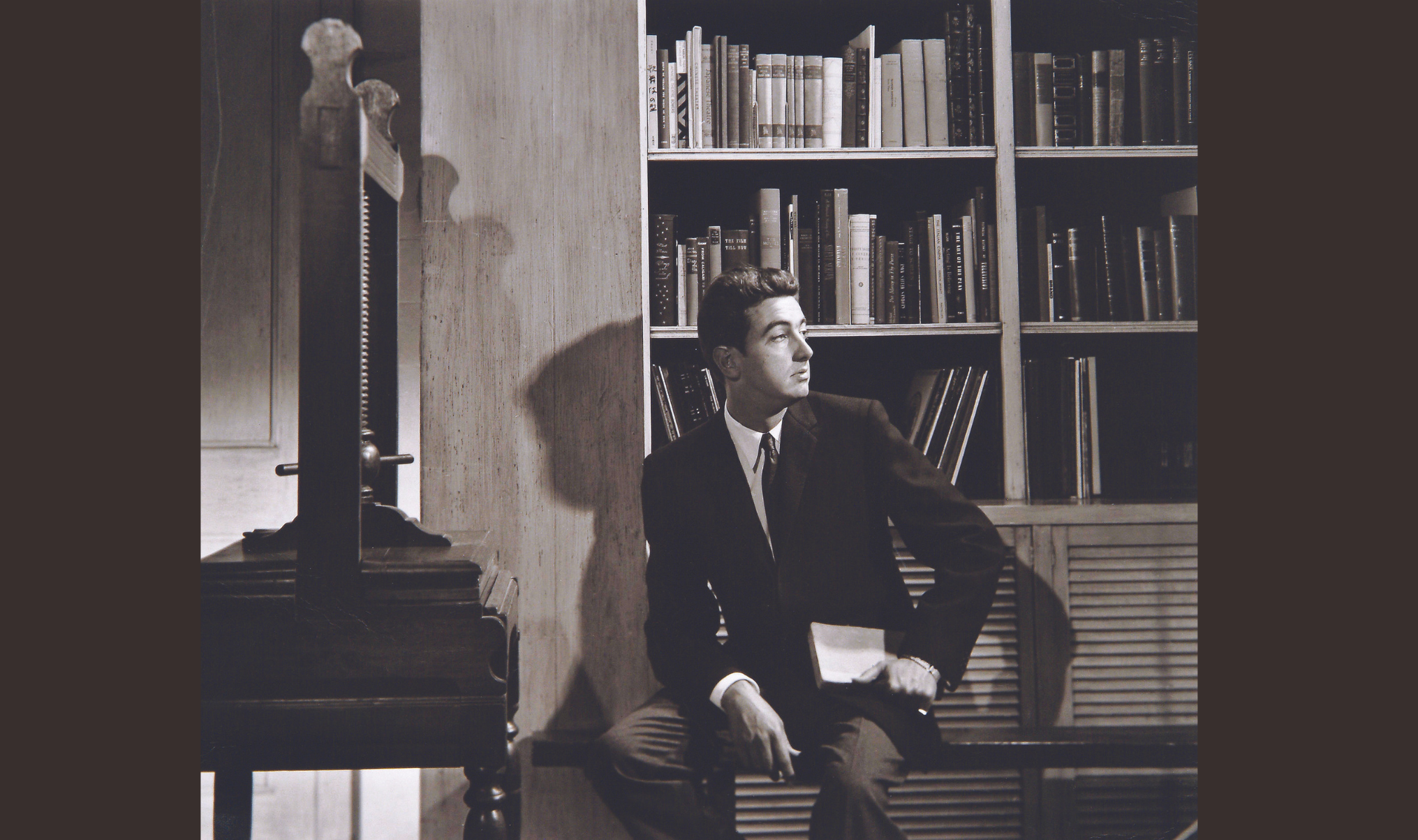 Man sitting in a library 