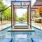 a swimming pool with a covered patio