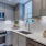 a kitchen with white cabinets