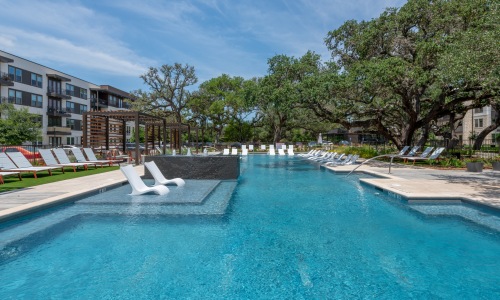 Resort style pool with in pool loungers