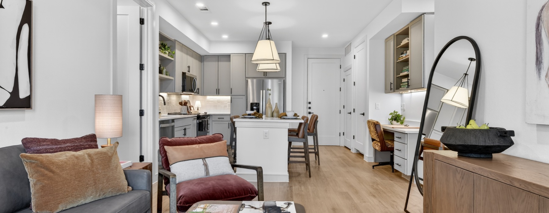 Living room and kitchen with stainless steel appliances