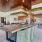 Large well lit leasing office with large windows and ample seating 