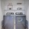 a washer and dryer and some shelves behind them