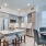 a kitchen with a table chairs and a refrigerator