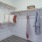 a closet with a shelves and hangers