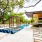 a swimming pool with a covered patio