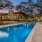 a swimming pool with a building in the background